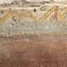 Catacombs of San Sebastiano Ancient graffiti carved into a wall, with some decorative paint and signs of cracking and erosion.